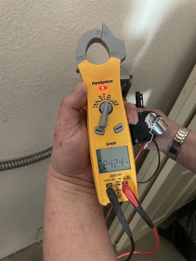 Voltage testing with clamp meter during Electrical Installation Services in Verona